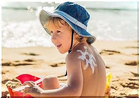 Child with a star of sunscreen on his back