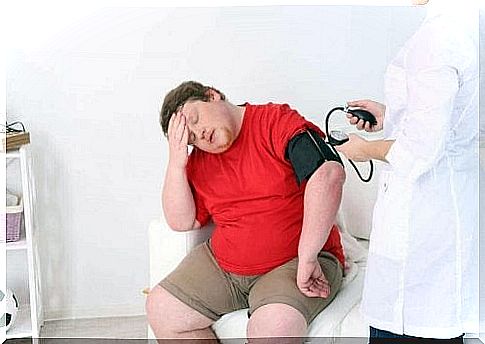 Doctor taking the blood pressure of an obese patient