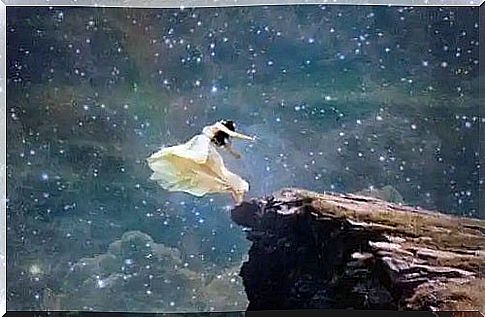 Woman sitting on a rock