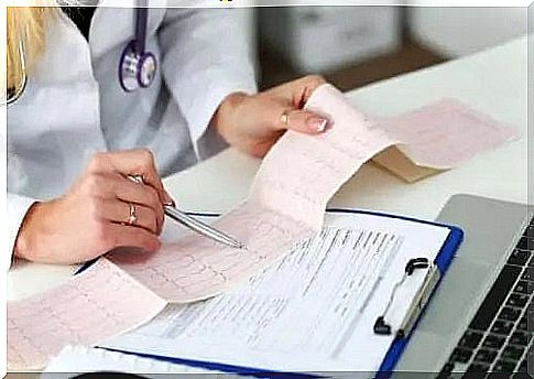 Physician interpreting a patient's electrocardiogram