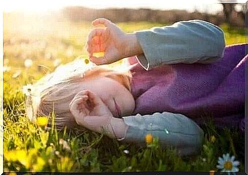 Happy little girl in the grass