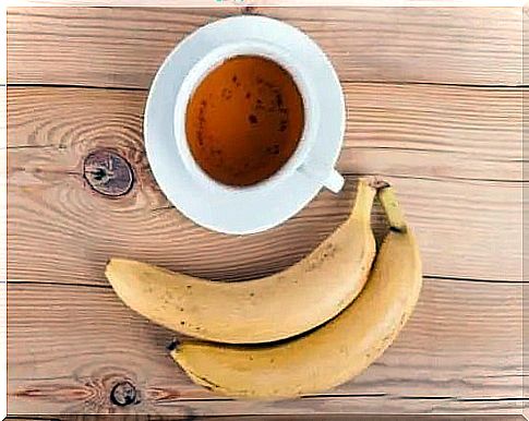 Banana next to a cup of tea