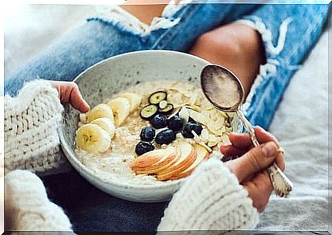 Girl eating oats for breakfast