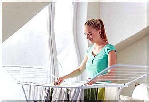 Woman putting clothes to dry