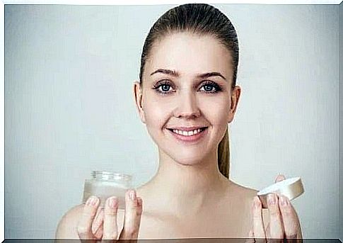 Woman showing how to use whitening creams