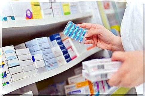 Pharmacist arranging medicines on the shelf